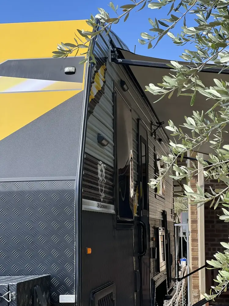 Caravan exterior weathered by Perth sun and dust